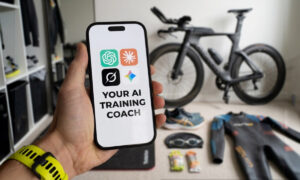 Athlete reviewing a training plan on a smartphone with a triathlon bike and gear in the background