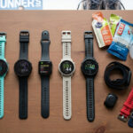 Garmin Forerunner 55, 165, Polar, Coros Pace and Apple Watch watches on a flat surface