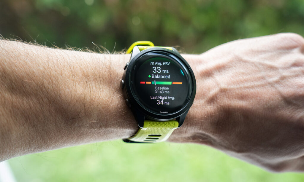 Endurance athlete checking HRV score on smartwatch before a morning training session