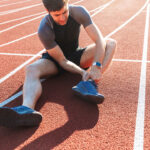 injured runner on a track