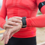 runner checking heart rate on a wrist gps watch