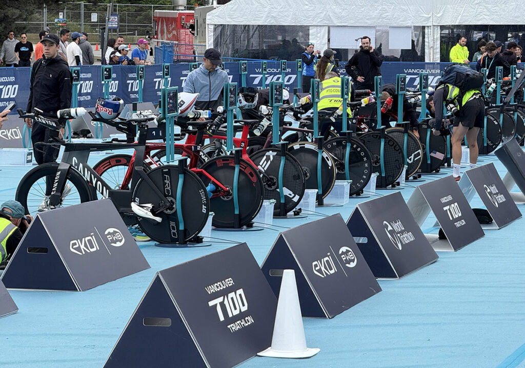 Professional triathletes' bikes racked in the T100 Vancouver transition zone.