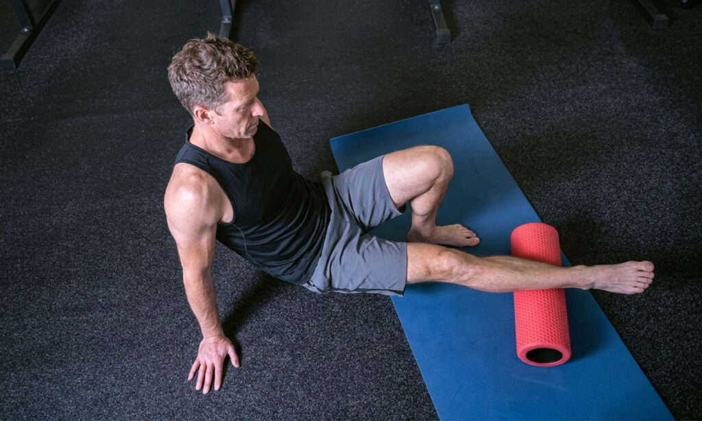 athlete over 40 doing foam roller for recovery