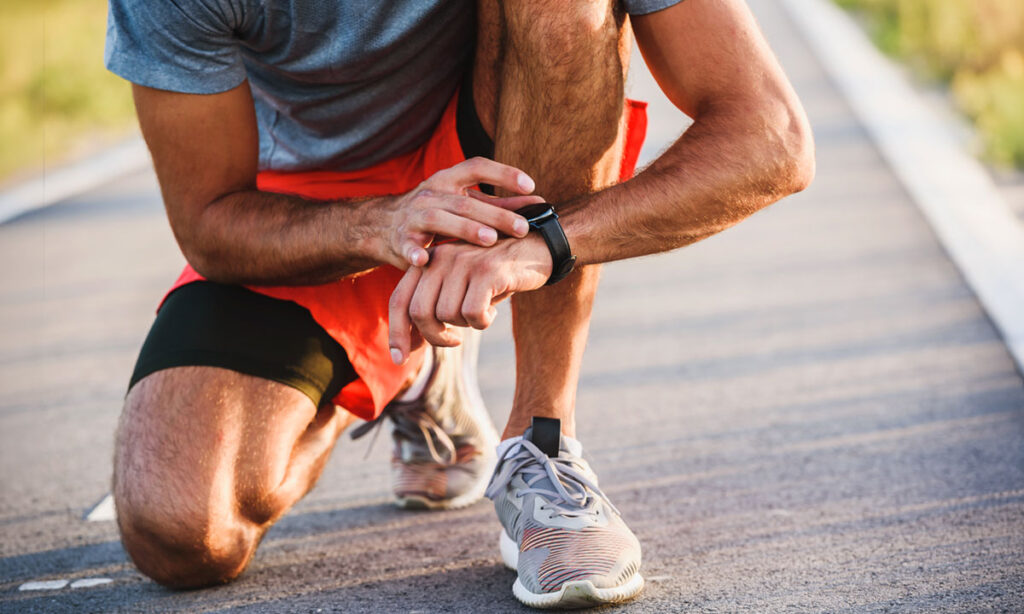 athlete checking their heart rate on a watch