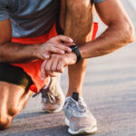 athlete checking their heart rate on a watch
