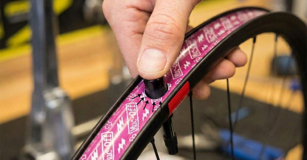 Tubeless valve installed in a road rim with the lock ring tightened